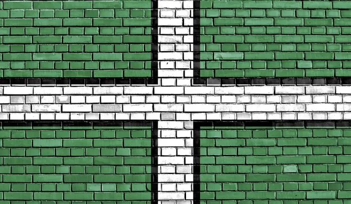 Impression encadrée : Drapeau du Devon peint sur un mur de briques. Impression encadrée : Drapeau du Devon peint sur un mur de briques.