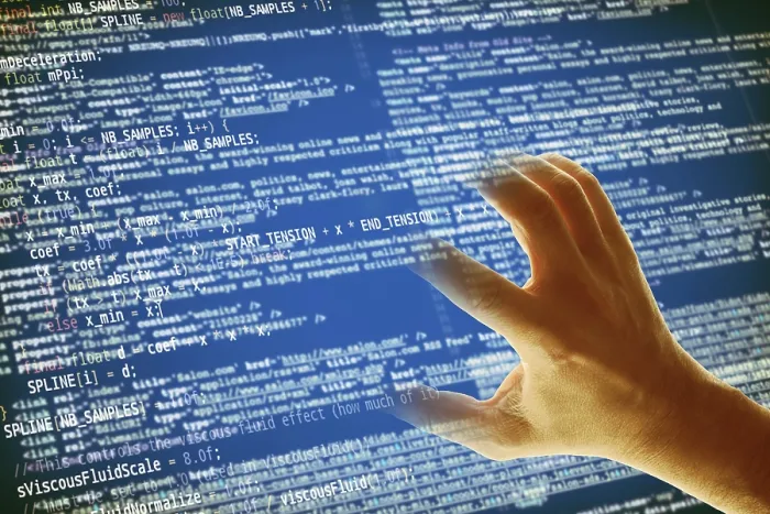 Impression encadrée : Une main saisissant un code informatique, concept de hacking et crime informatique. Impression encadrée : Une main saisissant un code informatique, concept de hacking et crime informatique.