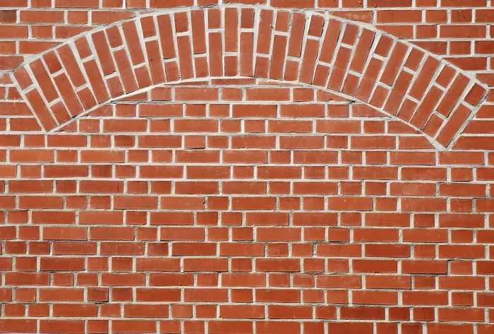 Impression encadrée : Mur de briques rouges avec une arcade. Impression encadrée : Mur de briques rouges avec une arcade.