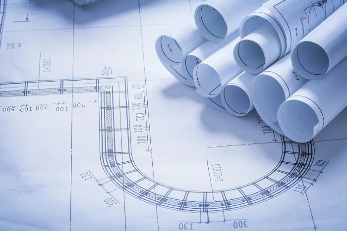 Impression encadrée : Pile de rouleaux de plans constructifs. Impression encadrée : Pile de rouleaux de plans constructifs.