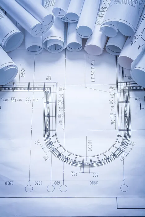 Impression encadrée : Pile de plans de construction concept de maintenance. Impression encadrée : Pile de plans de construction concept de maintenance.