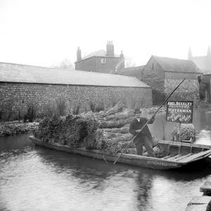 Print of Abel Beesley on his punt with bundles of rushes near Pacey Bridge