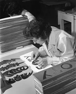 Female Factory Worker Impressions: Assembling a Sign