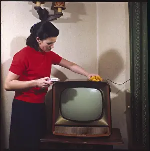 Vintage Domestic Scene Impressions: Dusting a Television