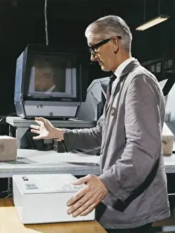 Historical Factory Images Impressions: Factory worker operating control box