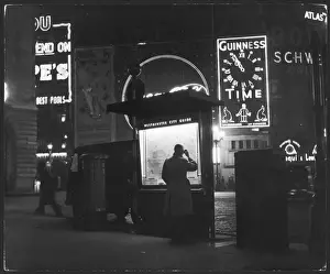 Piccadilly Circus At Night Impressions: Man Studying Map