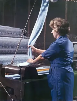 Textile Manufacturing Process Impressions: Threads entering a weaving machine