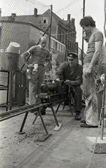 Railway Transport Impressions: Train driver prepares engine on model steam train