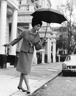 Young Woman With Umbrella Impressions: Watch your Step