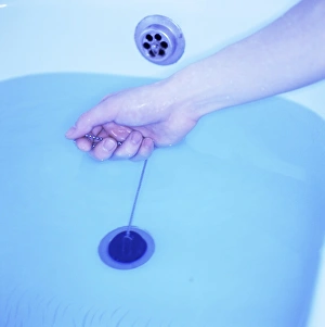 Bathroom Hygiene Habits Impressions: Bath plug being pulled