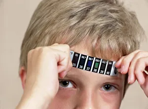Medical Diagnostic Equipment Impressions: Boy measuring his temperature