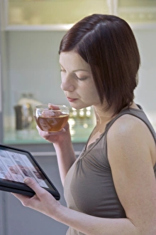 Woman Using Tablet Impressions: Tablet computer use C013 / 6039