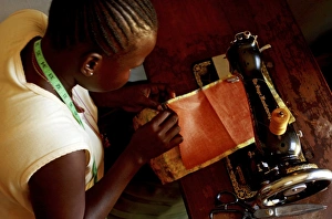 Poverty In Africa Impressions: Using a sewing machine, Uganda