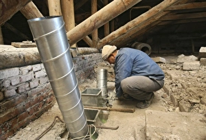 Construction Worker At Work Impressions: Worker installing ventilation