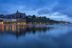 Stockholm Skyline Impressions: Skyline of Sodermalm at dusk reflection in water, Stockholm, Sweden, Scandinavia, Europe