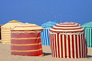 Normandy Coastal Scenery Impressions: Typical color striped beach cabins, beach and sea, Trouville sur Mer, Normandy, France