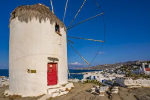 Mykonos Windmill Impressions: View of whitewashed windmill overlooking town, Mykonos Town, Mykonos, Cyclades Islands