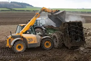 British Farm Machinery Impressions: JCB Loadall telehandler loading muck into muck spreader