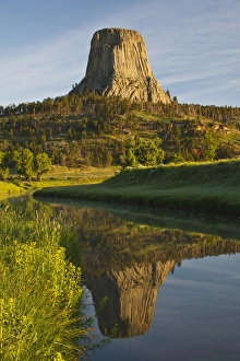 Devils Tower National Monument Impressions: Devils Tower National Monument, Wyoming, reflected in Belle Fourche River at sunrise