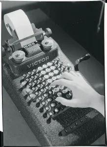 Antique Office Equipment Impressions: Hand Typing on an Adding Machine