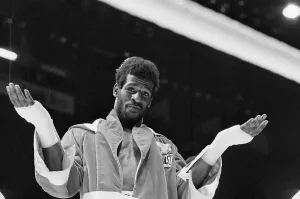Olympic Gold Medalists Impressions: Michael Spinks Gesturing in Ring