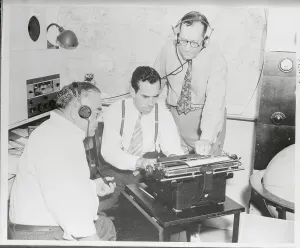 Vintage Radio Broadcasting Impressions: Radio Broadcasters Working on Script at Typewriter