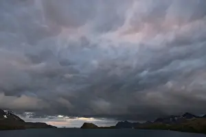 Overcast Mountain Range Impressions: Dramatic clouds at sunset, Stromness Harbour