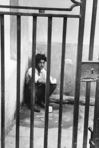 Isolated Male Figure Impressions: Behind Bars