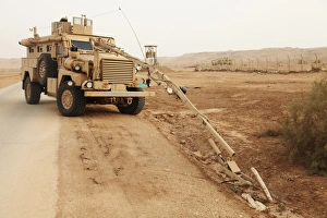 Middle East Military Operations Impressions: A MRAP vehicle disassembles an improvised explosive device