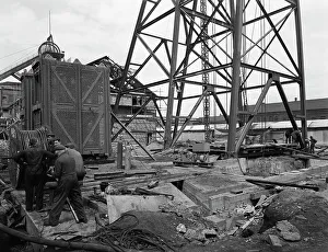British Coal Industry Impressions: Installing a cage at Hickleton Main pit, Thurnscoe, South Yorkshire, 1961. Artist