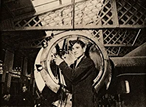 Metal Worker Impressions: A metal worker with automatic drill stripping an engine casing, 1940