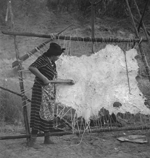 Female Artisan At Work Impressions: Method of scraping hide for softening