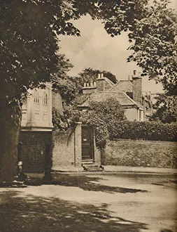 London Landscape Photography Impressions: Sunlight and Shadow in a Winding Highgate Road, c1935. Creator: Paterson