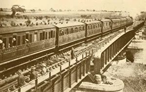 Black And White Train Images Impressions: A Train Passing Over The Bridge, c1930. Creator: Unknown