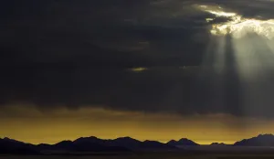 Desert Mountain Scenery Impressions: the sun breaks through the clouds in namibia, Namibia