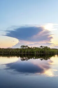Blue Hour Reflections Impressions: Unusual cloud formation exploding over wetlands
