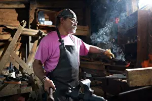 Blacksmith At Work Impressions: Blacksmith working in his forge