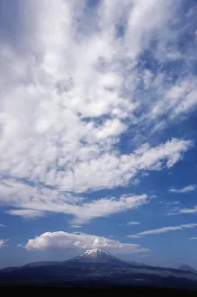 Tranquil Nature Scenes Impressions: Clouds over a snowcapped mountain