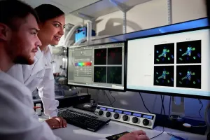 Computer Science Research Impressions: Scientists in laboratory using computer