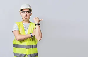 Construction Worker Pointing Impressions: Amazed Engineer pointing to side