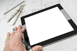 Residential Architecture Impressions: Architech working on blank computer tablet