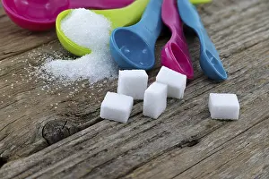 Deserted Grocery Store Impressions: Array of sugar presentations on a wooden table