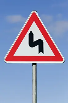 Blue Traffic Sign Impressions: Attention sharp turn