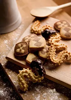 Unhealthy Sweets Impressions: Baking biscuits, board with various biscuits in kitchen