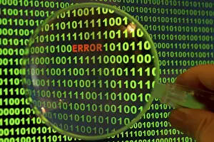 Computer Crime Scene Impressions: Binary code with the word 'Error' viewed through a magnifying glass Binary code with the word
