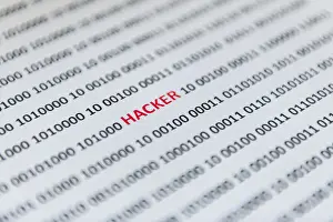 Online Data Transmission Impressions: Binary code with the word hacker, Austria