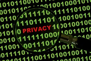 Computer Crime Scene Impressions: Binary code with the word 'Privacy' viewed through a magnifying glass Binary code with the word