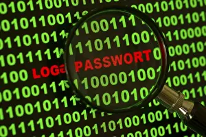 Computer Hacking Crime Impressions: Binary code with the words 'Login Passwort' viewed through a magnifying glass Binary code with the words
