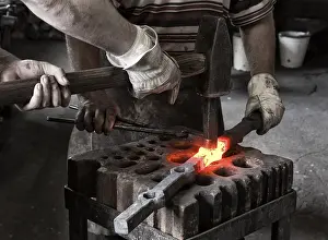 Handicraft Trade Impressions: Blacksmith and his assistant at work