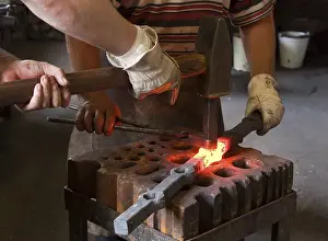 Berlin Germany Impressions: Blacksmith and his assistant at work